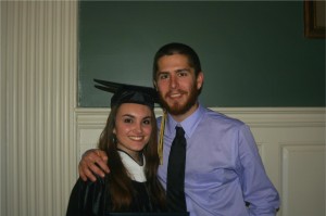 graduating woman posing with man