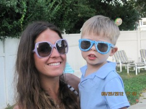 woman and child both wearing sunglasses